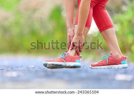 Side stitch - woman runner side cramps after running. Jogging woman with stomach side pain after jogging work out. Female athlete.