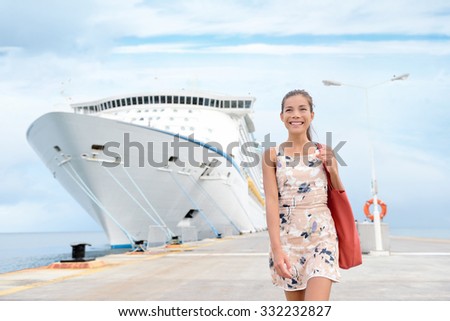 Cruise ship travel going shopping in port on travel cruise vacation at sea. Happy mixed race Asian Chinese Caucasian woman in dress by luxury cruise liner boat.