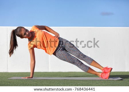 Side plank fitness woman training body core planking exercise. Workout at outdoor gym or home garden Asian girl exercising obliques abs muscles with yoga pose plank.