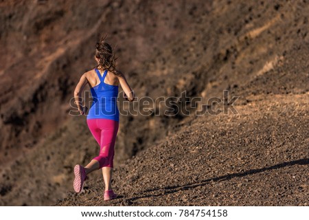 Woman running outside to lose weight, cellulite fat burning concept. Female runner girl training body for weight loss during summer outdoor workout. Sport lifestyle.
