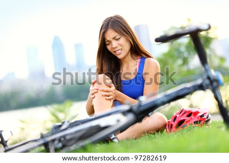 stock-photo-knee-pain-bike-injury-woman-with-pain-in-knee-joints-after-biking-on-bicycle-girl-sitting-down-97282619.jpg