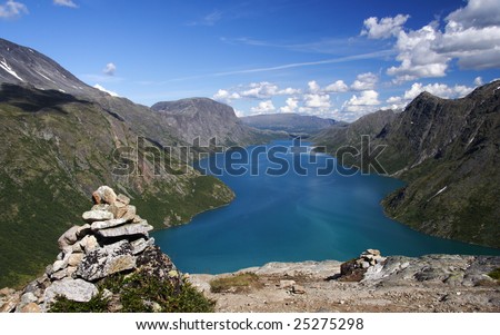 Cairn / Stone pile marking the famous Bessegen hiking trail in Jotunheim National Park, Norway. Gjende Lake.