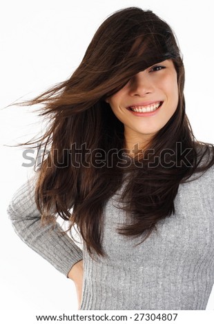 stock photo Beautiful young eurasian woman smiling with wind in the hair