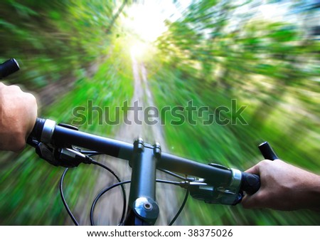 Mountain bike speed zoom motion blur. Fast downhill biking.