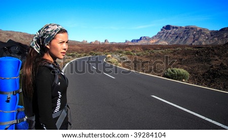 Woman traveler on the roadside on Tenerife