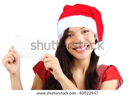 Christmas woman holding blank paper sign. Very beautiful mixed race asian / caucasian woman smiling. Isolated on white background.