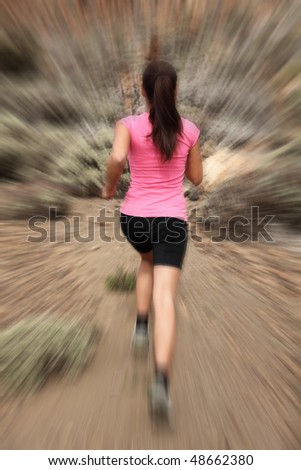 Running - woman runner in motion zoom blur for speed effect. Female running outside in desert.