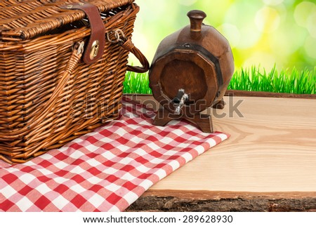 Picnic basket on the table with tun cloth top angle