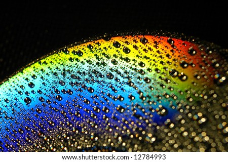 Abstract view of CD covered with water drops