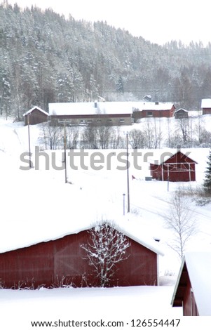 Red barns at winter in finland