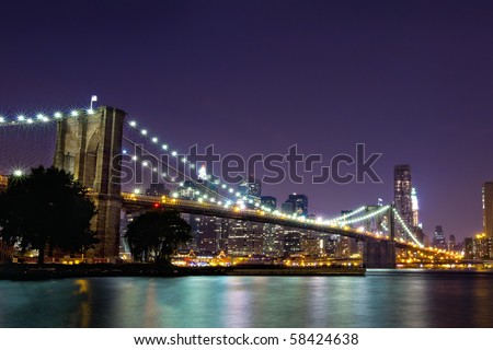 New York Skyline at night with Brooklyn Bridge