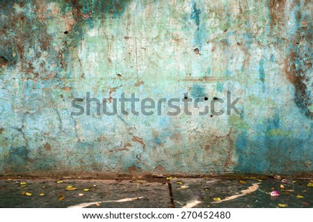 Dirty blue wall on a street