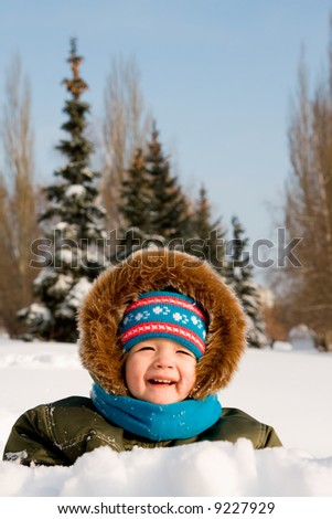 Little kid play with snow
