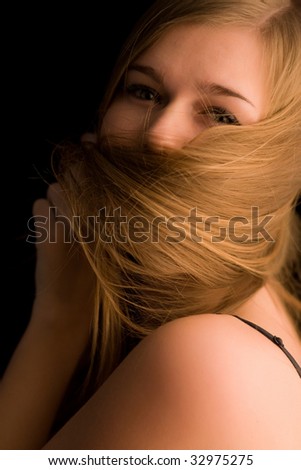 Woman with long hair blowing in her face