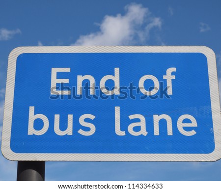 End of bus lane sign over blue sky