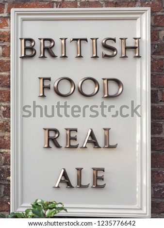 british food real ale sign on a pub wall