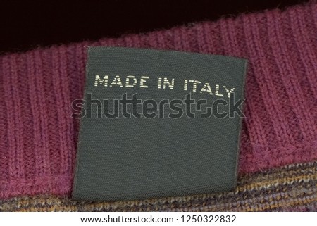 Made in Italy label on a woolen jumper jersey sweater garment