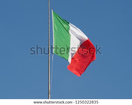 the Italian national flag of Italy, Europe over blue sky