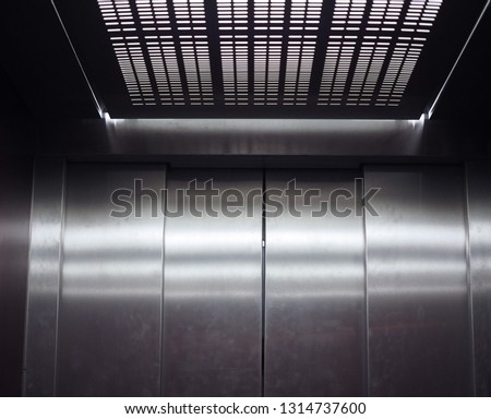 empty steel metal lift or elevator interior