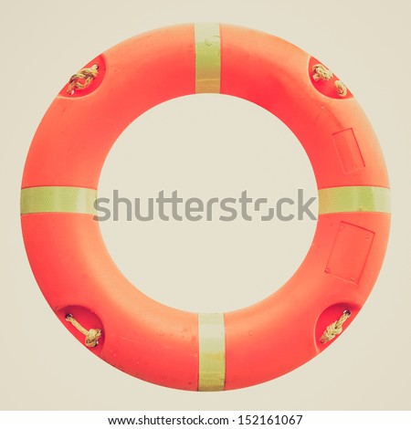 Vintage looking A life buoy for safety at sea - isolated over white background