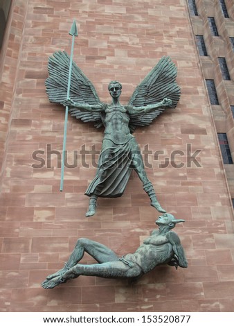 COVENTRY, ENGLAND, UK - SEPTEMBER 22: St Michael and the Devil sculpture by famous artist Jacob Epstein at Coventry Cathedral on September 22, 2011 in Coventry, England, UK