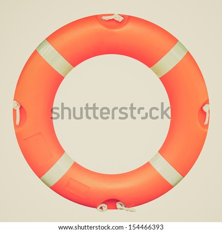 Vintage looking A life buoy for safety at sea - isolated over white background