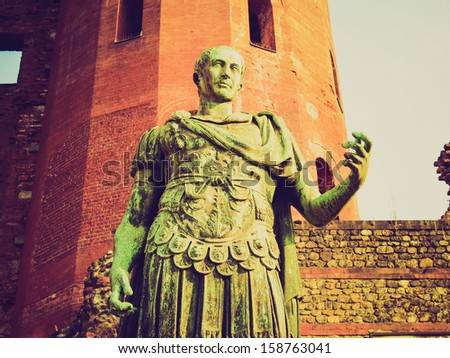 Vintage looking A bronze roman statue in Turin, Italy