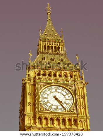 Vintage look Big Ben Houses of Parliament Westminster Palace London gothic architecture - over blue sky background