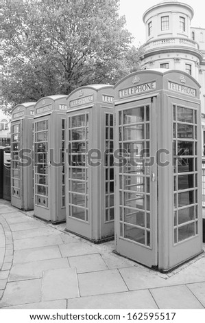 Traditional red telephone box in London UK in black and white