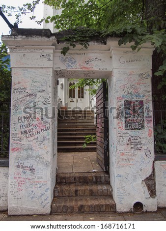 LONDON, ENGLAND, UK - JUNE 18, 2011: Graffiti by Beatles fans on the wall of the Abbey Road studios where the homonymous album was recorded in 1969