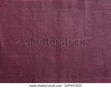 Maroon textile fabric texture useful as a background