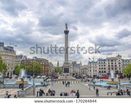LONDON, ENGLAND, UK - MAY 11, 2010: Tourists visiting Trafalgar Square and the Nelson column