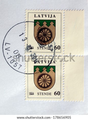 RIGA, LATVIA - FEBRUARY 21, 2014: A stamp printed by Latvian Posts shows the coat of arms of Stende