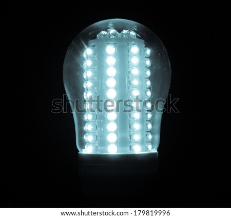 A lit LED Light Emitting Diod bulb - cool cyanotype