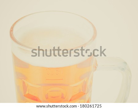 Vintage retro looking Large German bierkrug beer mug tankard glass, half litre, one pint - isolated over white background