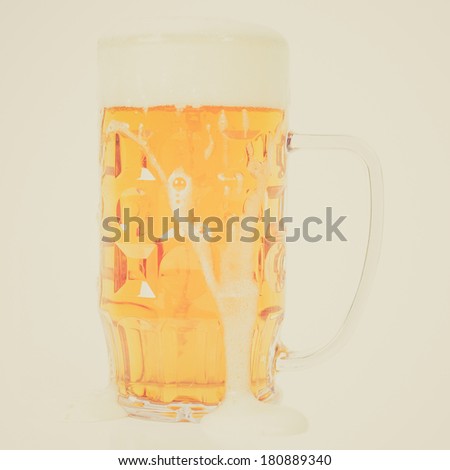 Vintage retro looking Large German bierkrug beer mug tankard glass of Lager - isolated over white background