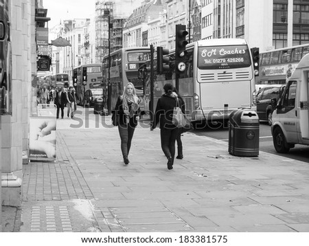 LONDON, ENGLAND, UK - OCTOBER 23: Tourists walking on The Strand busy high street on October 23, 2013 in London, England, UK