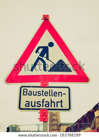 Vintage retro looking Road works sign for construction works in progress - in German