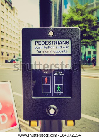 Vintage retro looking A pedestrian crossing sign - press button and wait for signal opposite