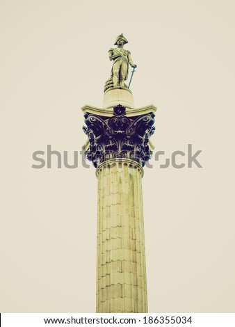 Vintage looking Nelson Column monument in Trafalgar Square London UK - isolated over white background