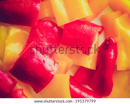 Vintage retro looking Red and yellow peppers useful as a food background