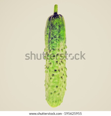 Vintage retro looking English cucumber vegetable isolated over a white background