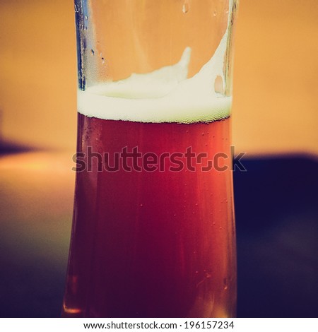 Vintage retro looking Detail of a glass of German weiss beer
