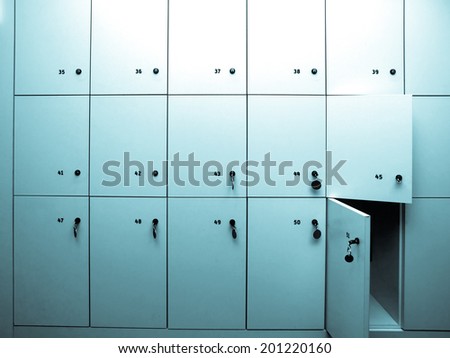 Lockers cabinets in a locker room at school or museum or station - cool cyanotype