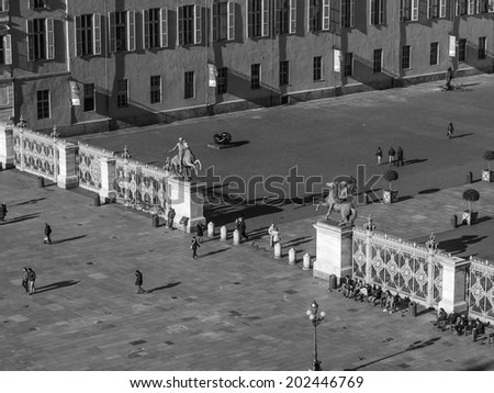 Tourists visiting Piazza Castello, the central baroque square