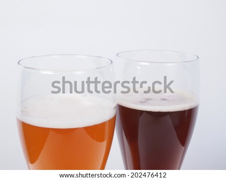 Two glasses of German dark and white weizen beer