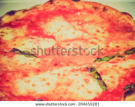 Vintage retro looking Italian pizza margherita aka margarita with tomato and mozzarella cheese