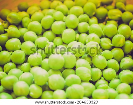 Vintage retro looking Green peas useful as a food background - selective focus