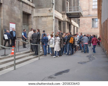 BERLIN, GERMANY - MAY 10, 2014: People queuing in front of the Pergamon Museum of antiquities on the Museumsinsel