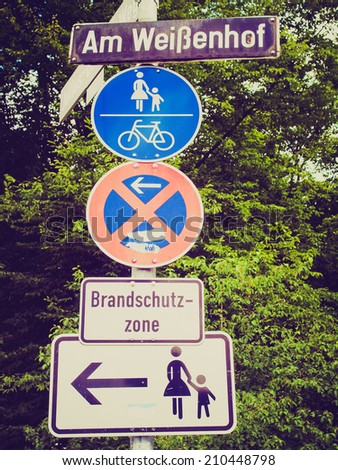 Vintage retro looking A road sign for a pedestrian zone, bike lane and no parking